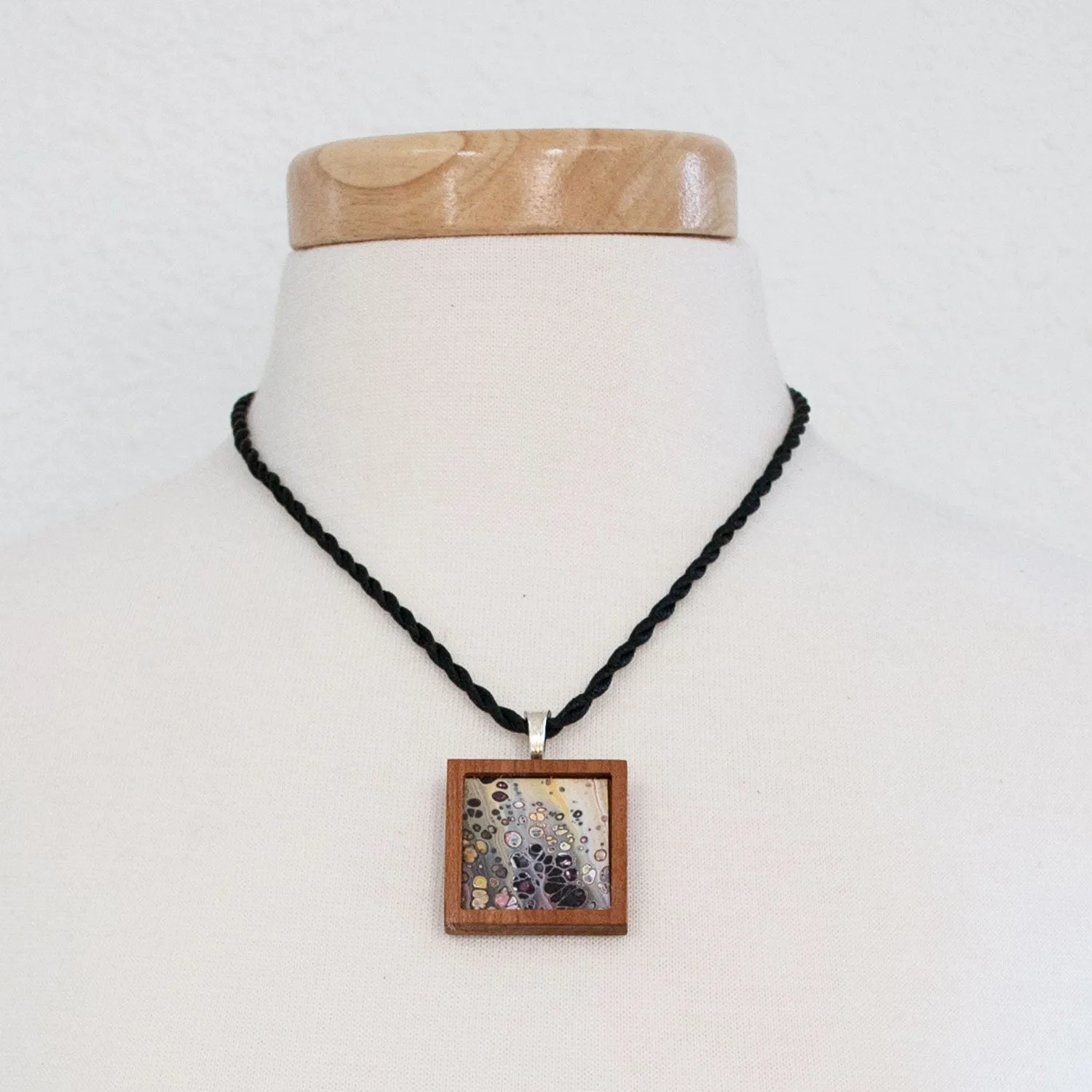 Art Necklace, black and earth tones painting in hardwood frame