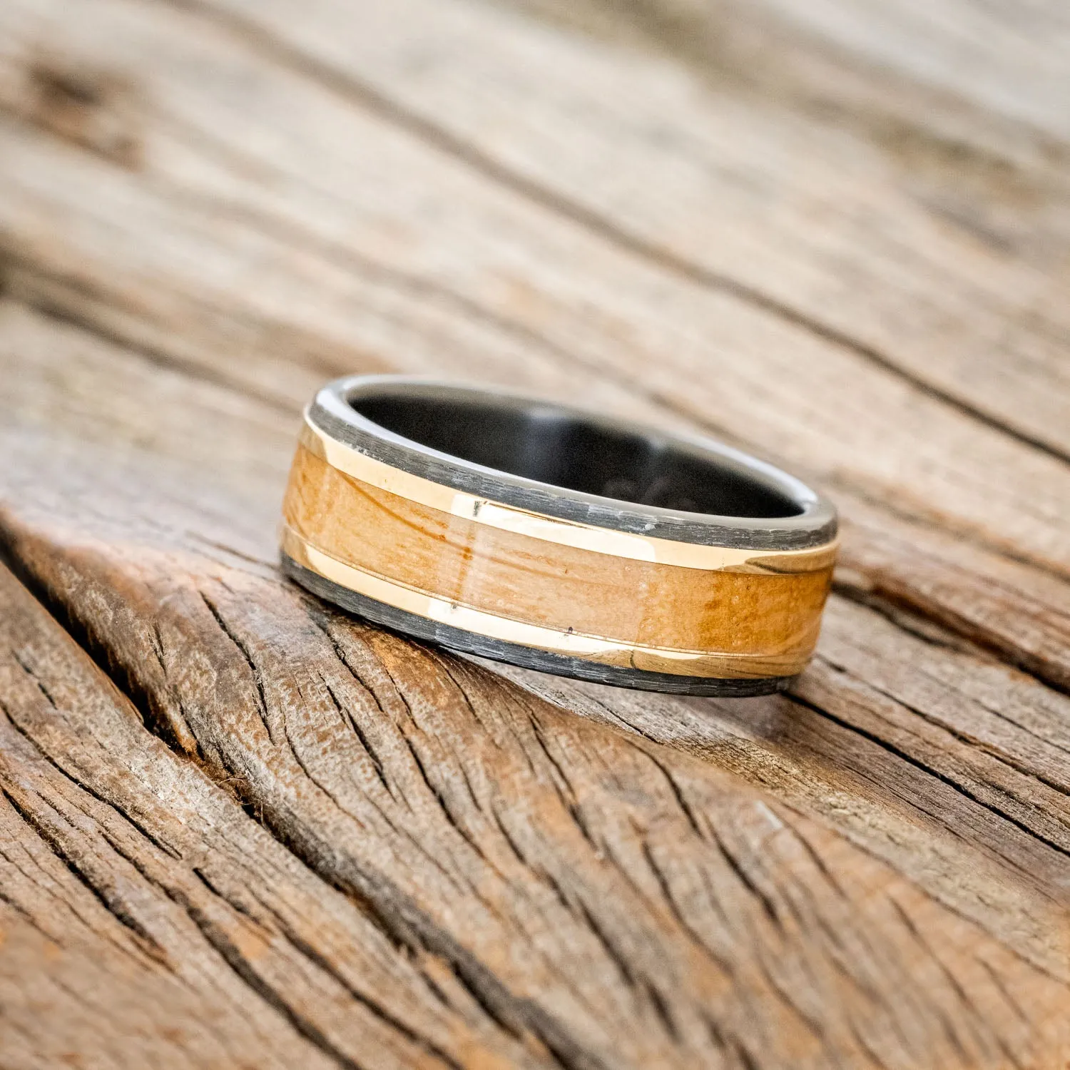 "HOLLIS" - WHISKEY BARREL & 14K YELLOW GOLD INLAYS WEDDING RING FEATURING A HAMMERED BAND - BLACK ZIRCONIUM - SIZE 11