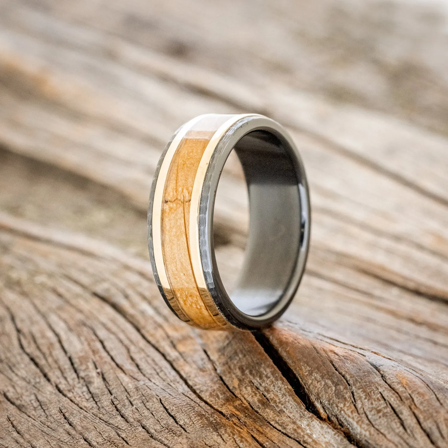 "HOLLIS" - WHISKEY BARREL & 14K YELLOW GOLD INLAYS WEDDING RING FEATURING A HAMMERED BAND - BLACK ZIRCONIUM - SIZE 11