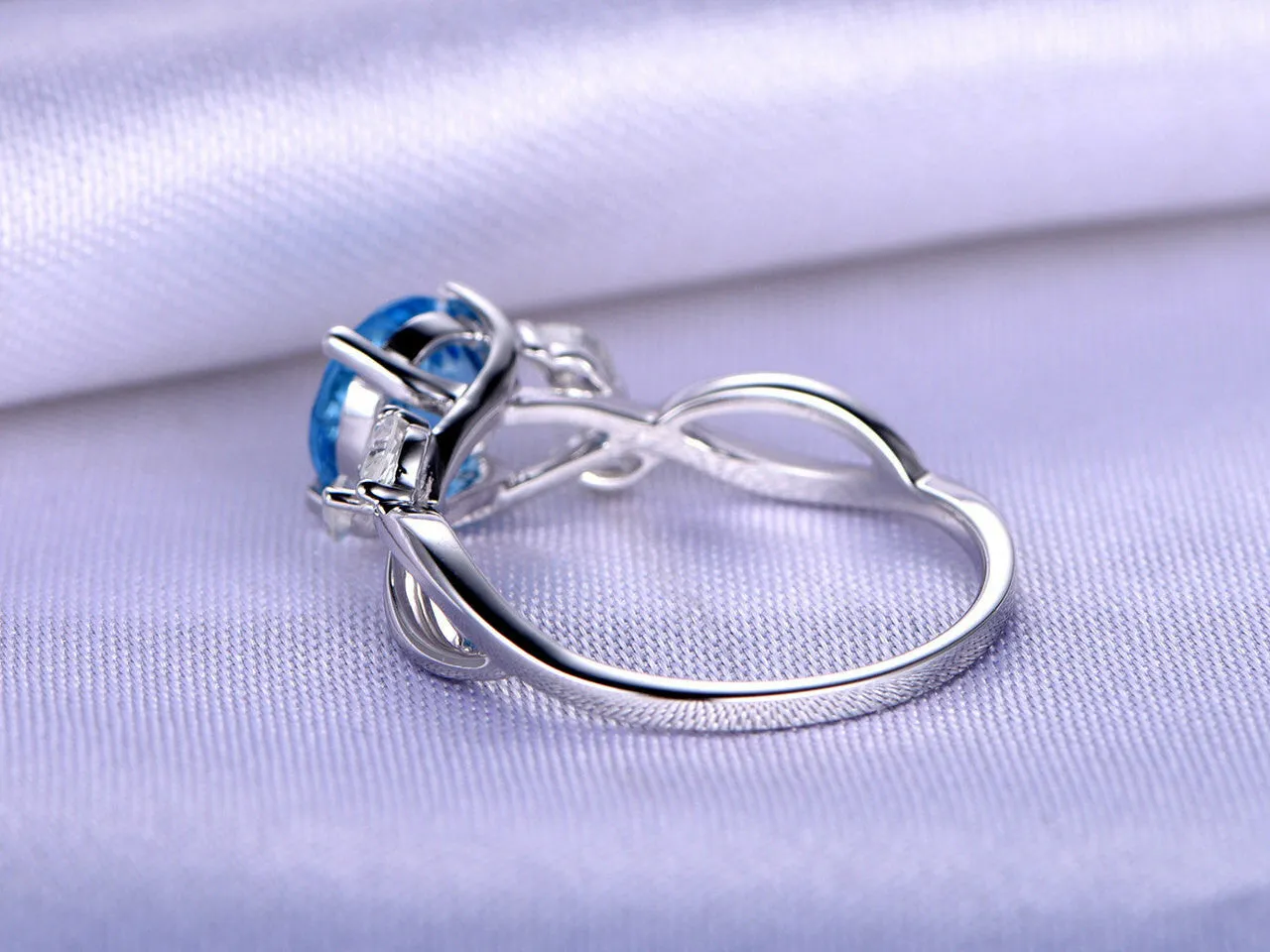 Unique 1.75 Carat Round Cut Blue Topaz Engagement Ring in White Gold