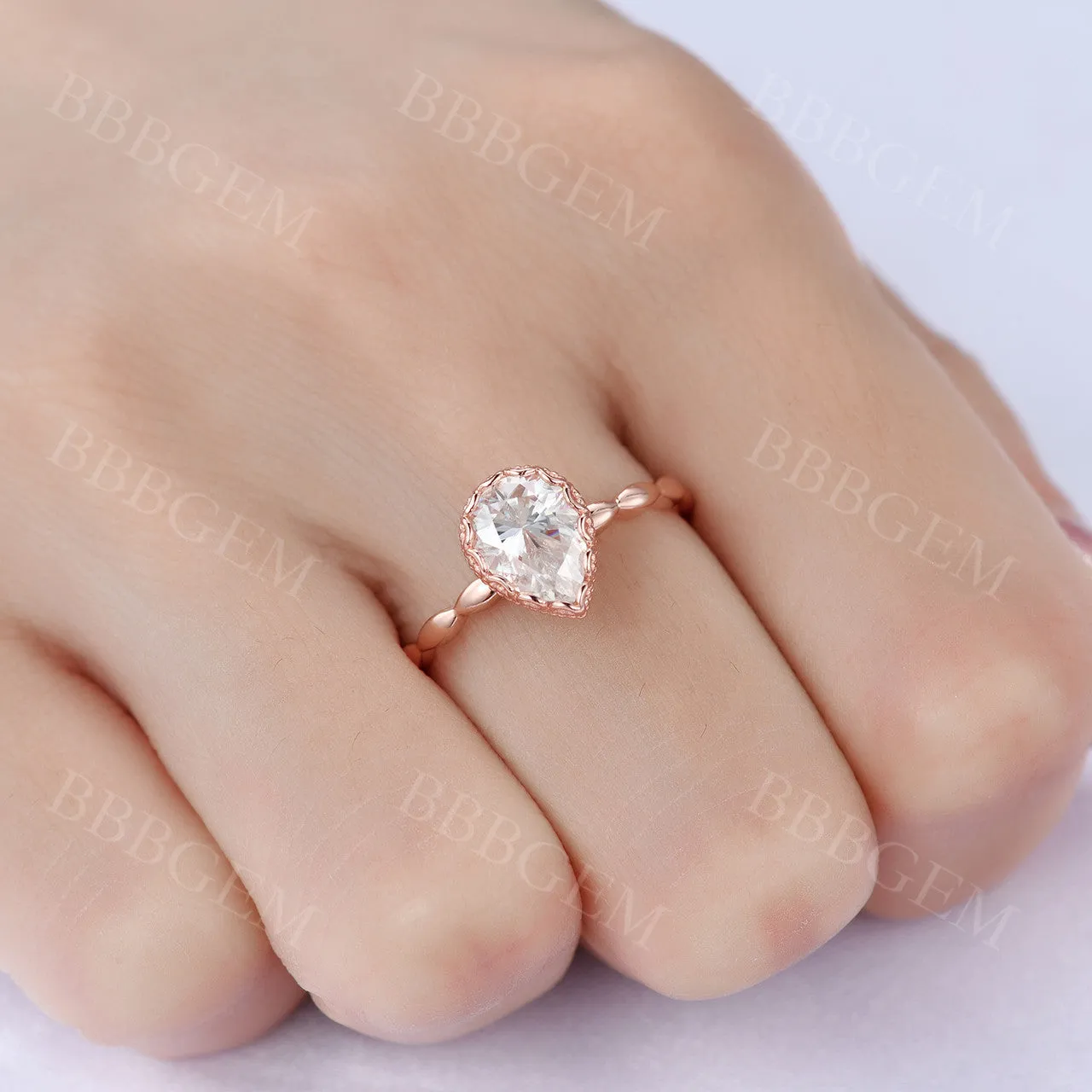 Unique Pear Cut 1.25 Carat Moissanite Engagement Ring Bezel Set Rose Gold